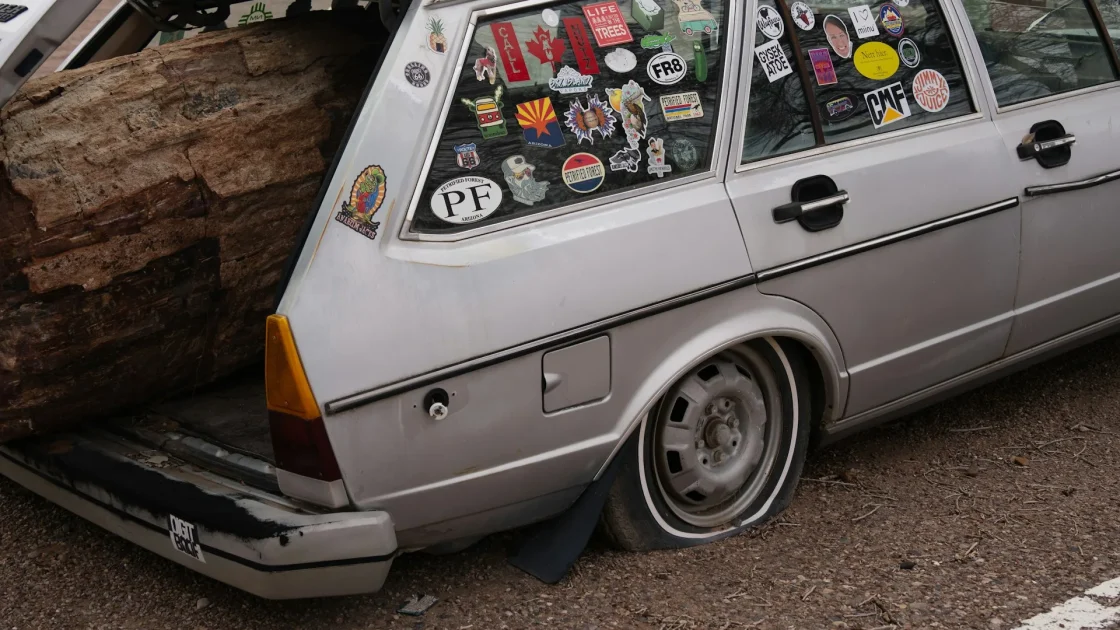 A new-car window sticker listing driver-assist safety features and acronyms.