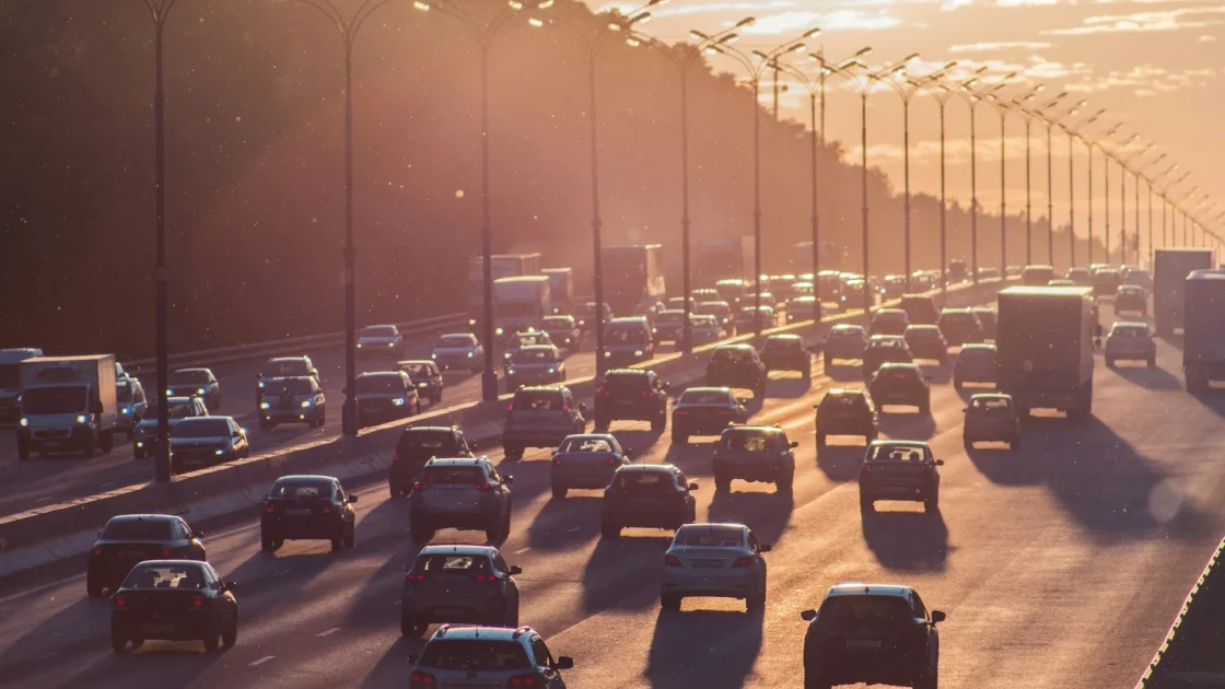 Bumper-to-bumper highway traffic where a car's traffic jam assist system handles the slow stop-and-go crawl automatically.