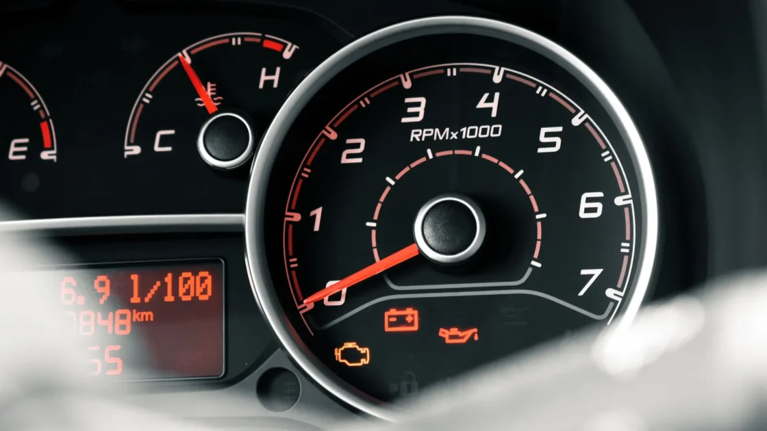 A modern car with visualized sensor coverage zones from cameras and radar spreading out around the vehicle.